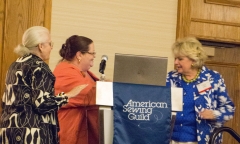 Janelle Archer and Margo Martin present Louise Cutting with the ASG Hall of Fame Award