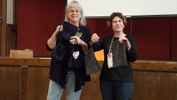 Norma Womack and Marilyn John showing off GownTown bags