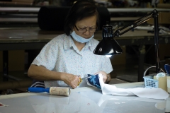 Once the embroidery is done, the felt has to be trimmed away to show the contrasting fabric under the letters